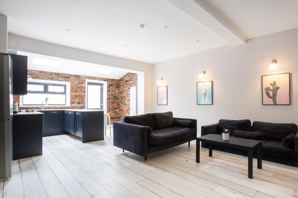 Bright open-plan living area with contemporary ...