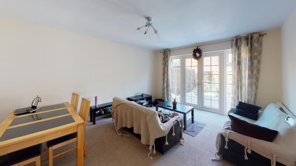 Bright and inviting living room featuring a com...