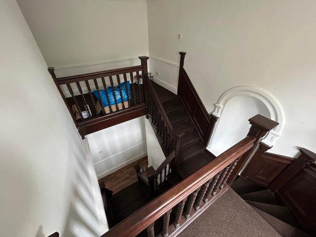 A charming staircase with elegant woodwork, pro...