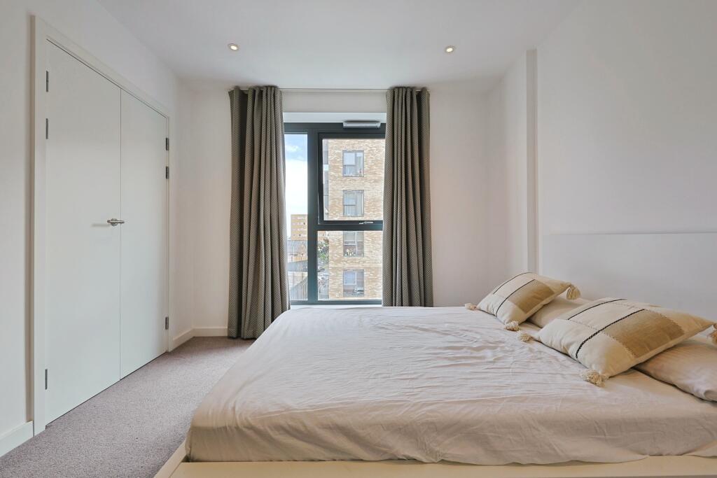 Bright and inviting double bedroom featuring a ...