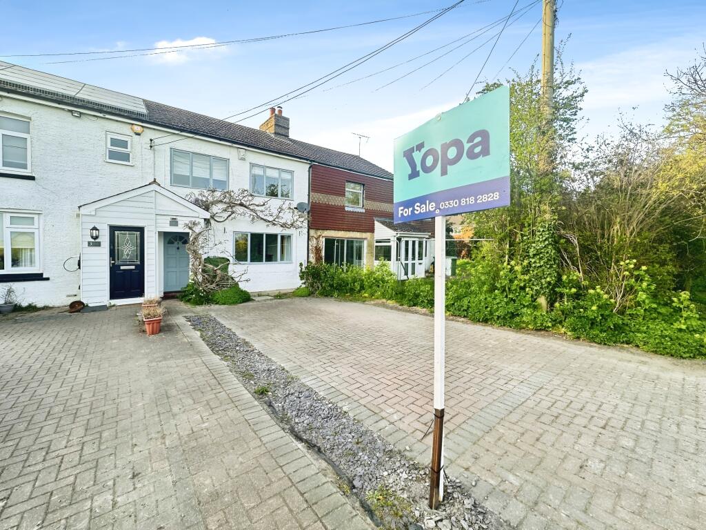 Front View Of The Property With Driveway Parking