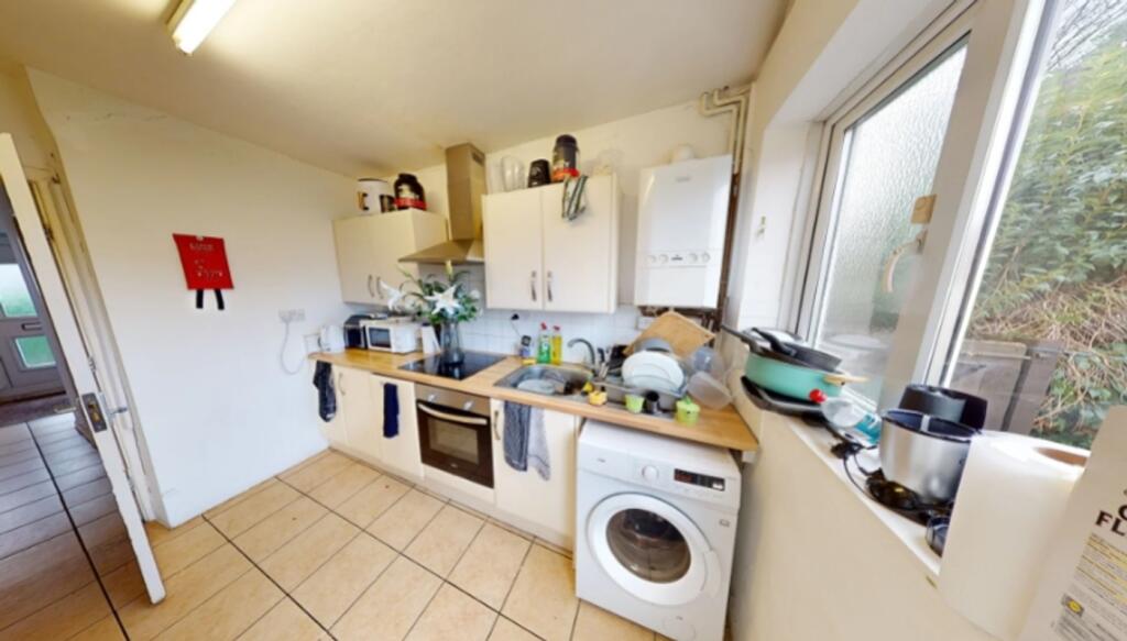 A bright and functional kitchen featuring essen...