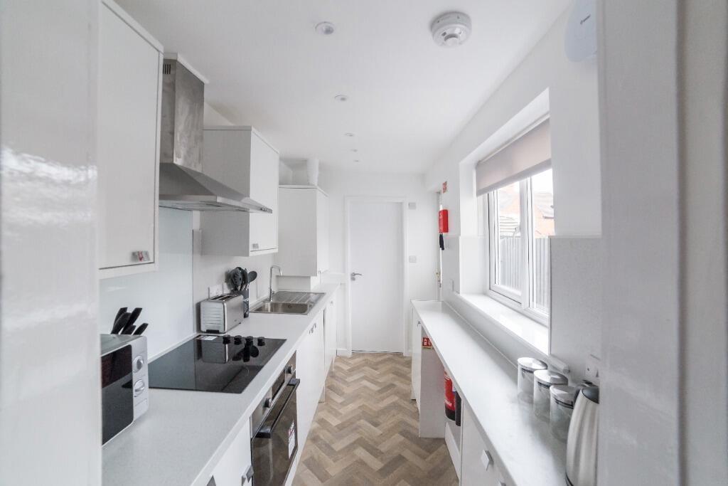 This modern kitchen features ample counter spac...