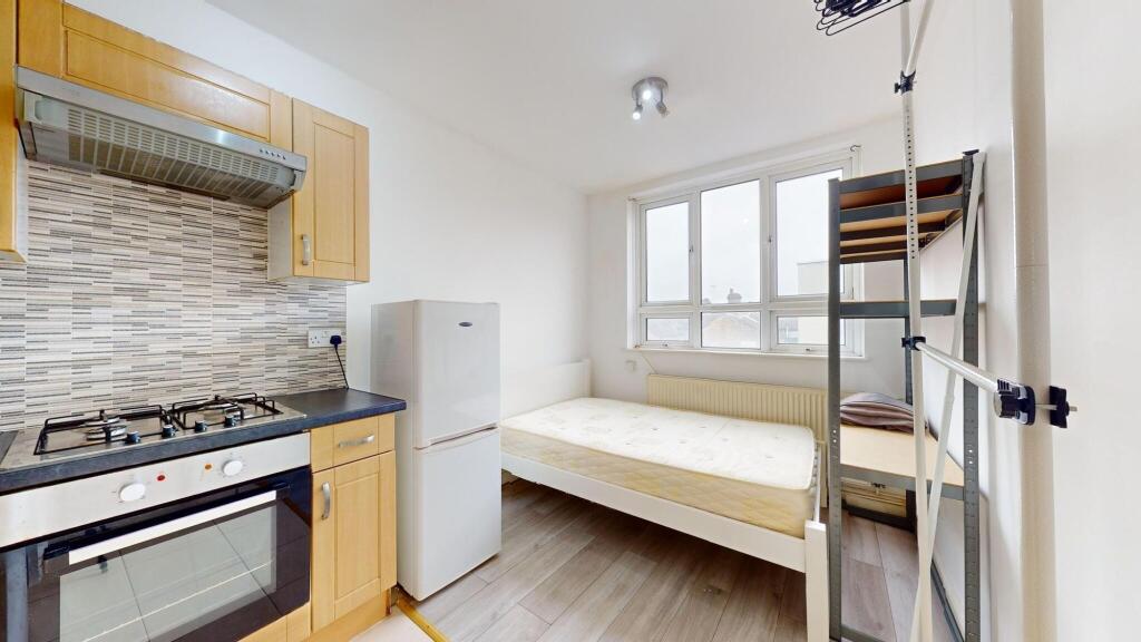 Bright and airy living space featuring large wi...