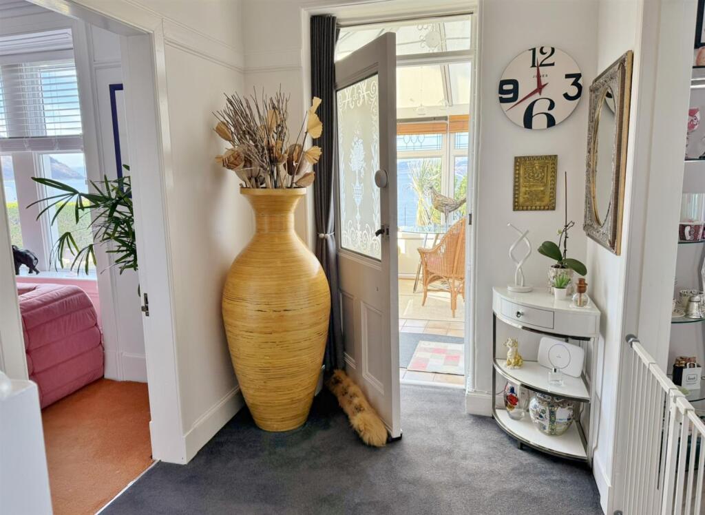 Front door to sun room entrance hallway