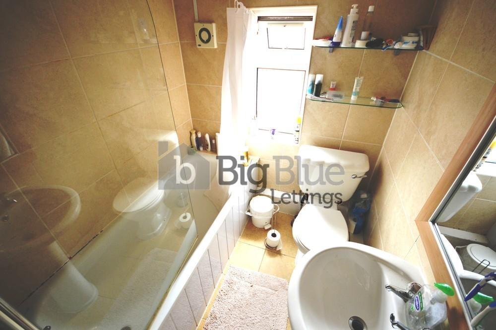 A bright and well-maintained bathroom featuring...