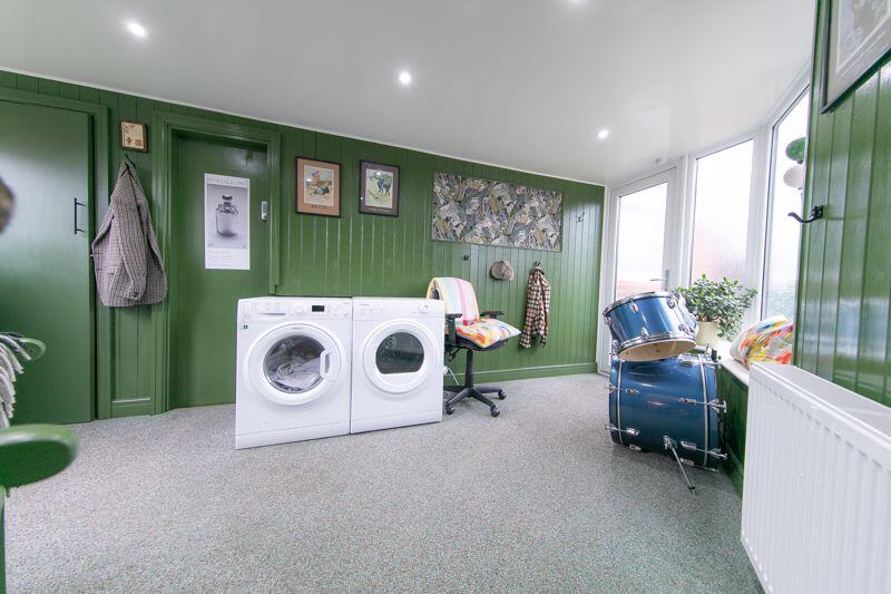 Side porch and utilities room