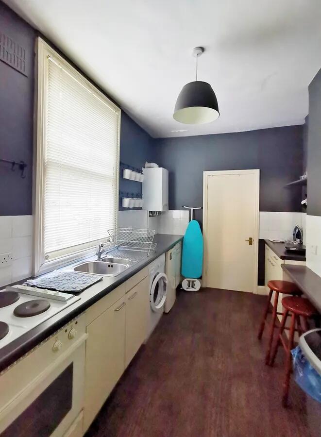 Bright and practical galley kitchen featuring m...