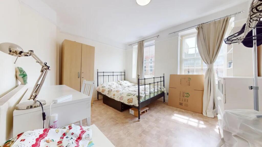 Bright and airy double bedroom featuring a stur...