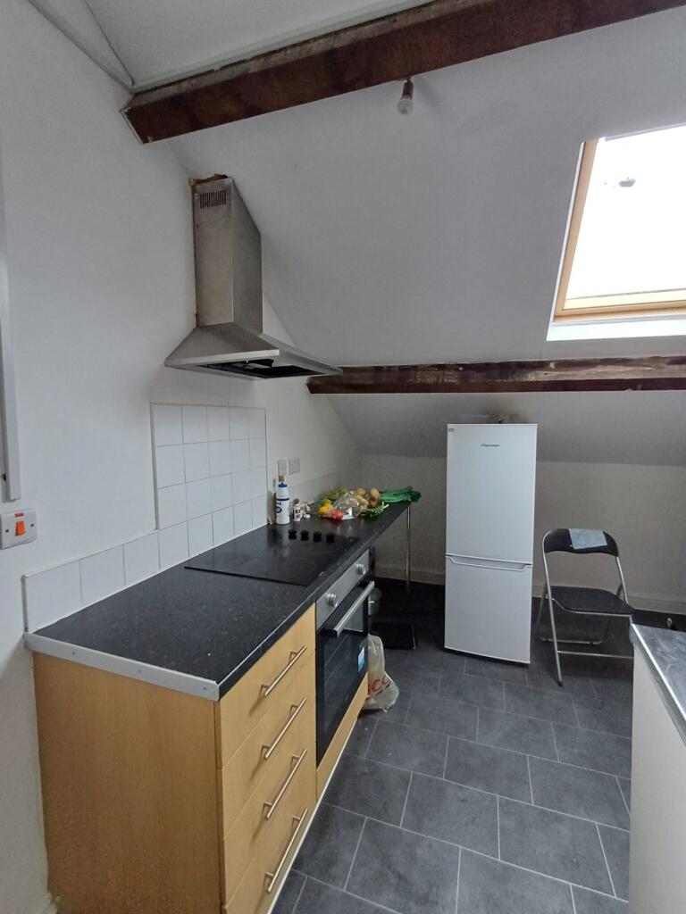 Bright and modern kitchen featuring ample count...