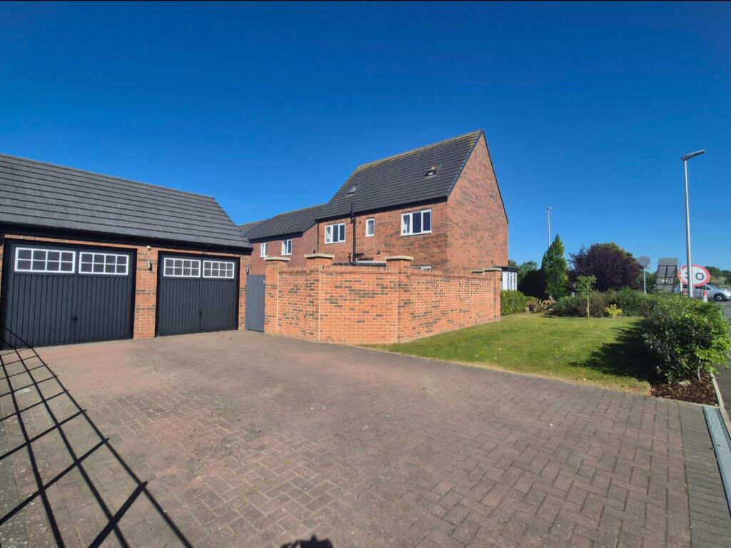 Double garage and driveway