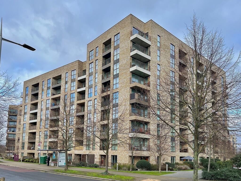 Modern multi-storey apartment building with bal...