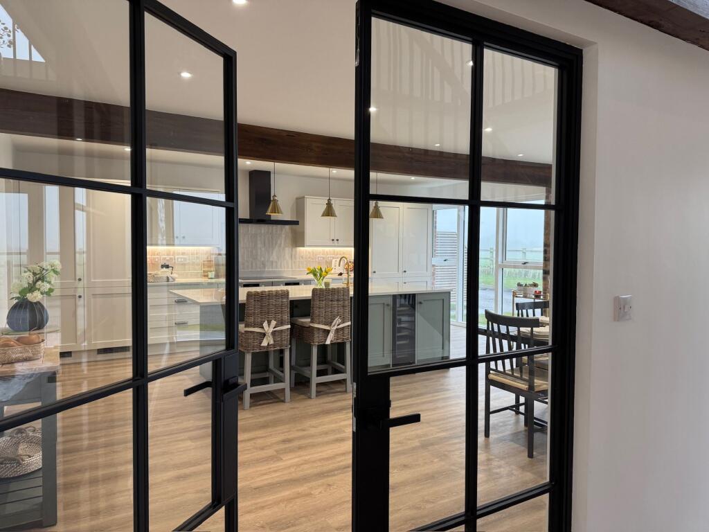 Glass crittall doors to the kitchen/diner
