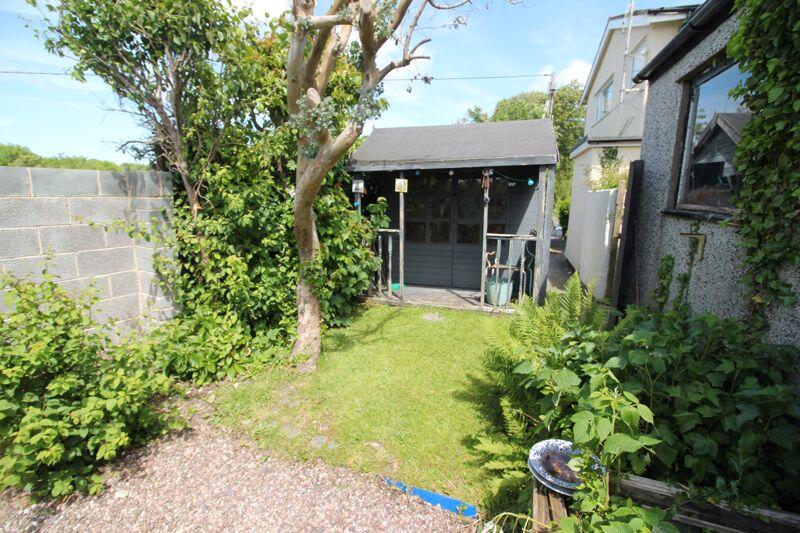 rear enclosed garden and summer house