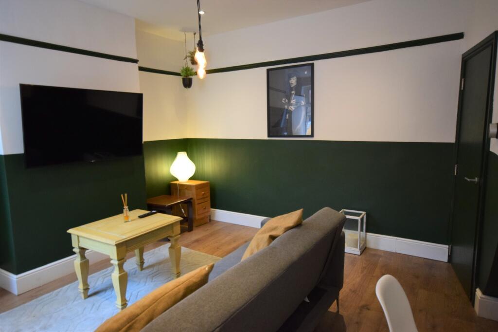 A stylish and modern living room featuring a co...