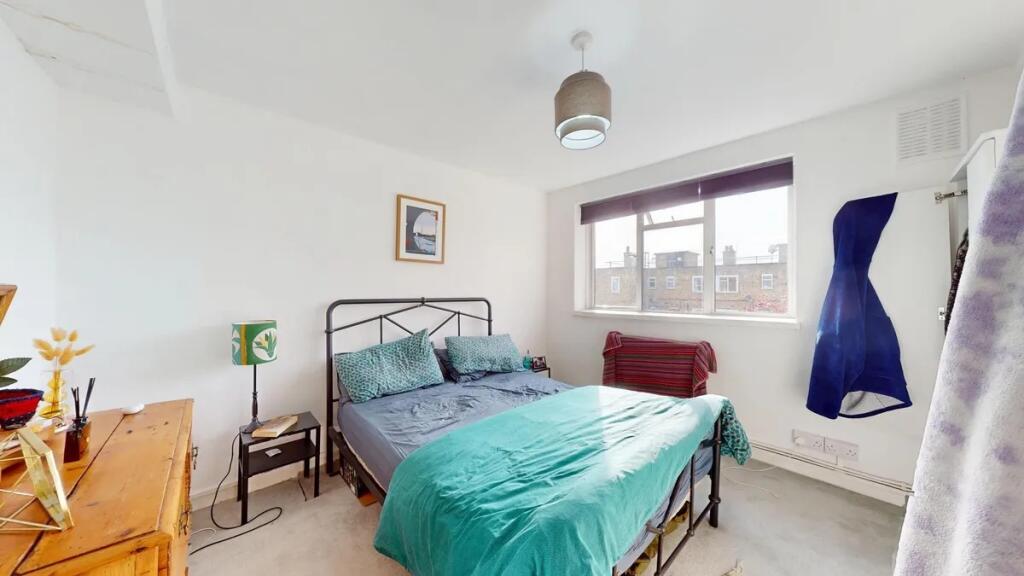 Bright and inviting double bedroom featuring a ...