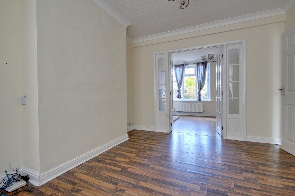 French doors separate the Lounge from the Dining R