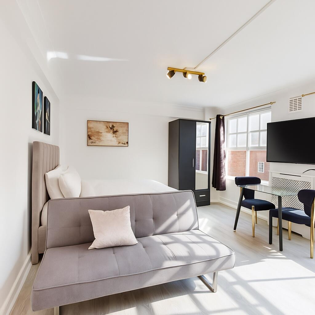 Bright and spacious living area featuring large...