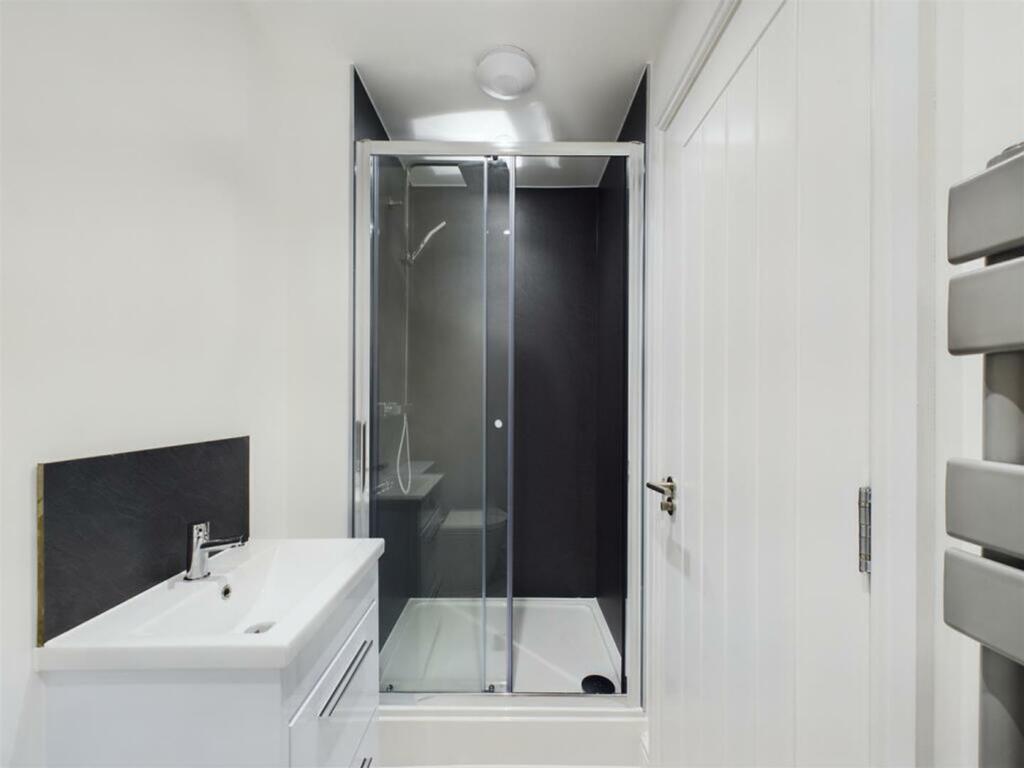 A modern and stylish bathroom featuring a sleek...
