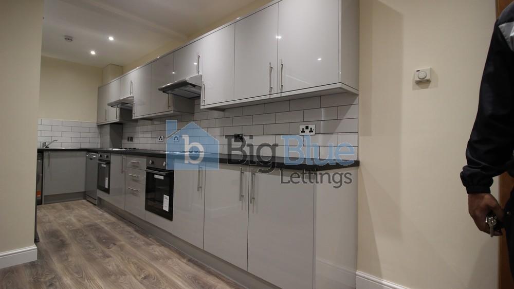 A modern, well-maintained kitchen featuring sle...