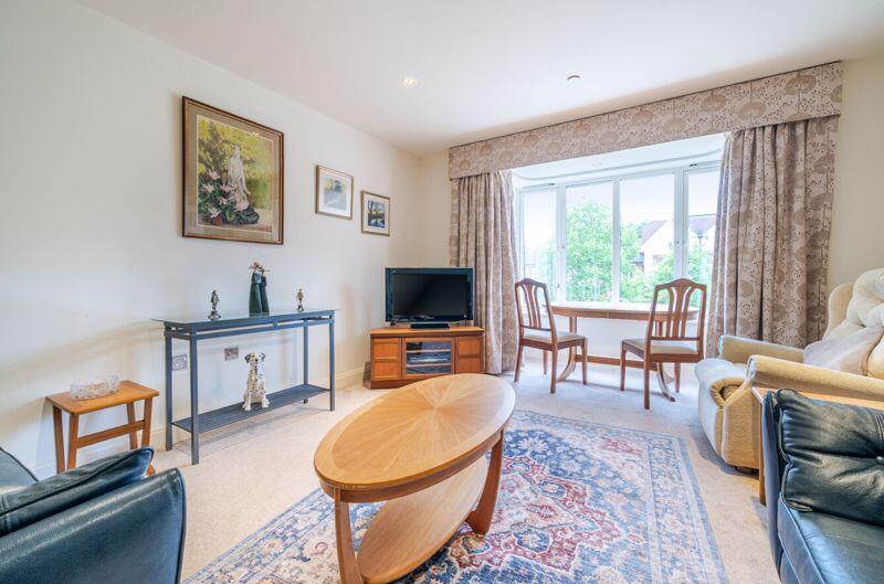 Living/dining room with bay window
