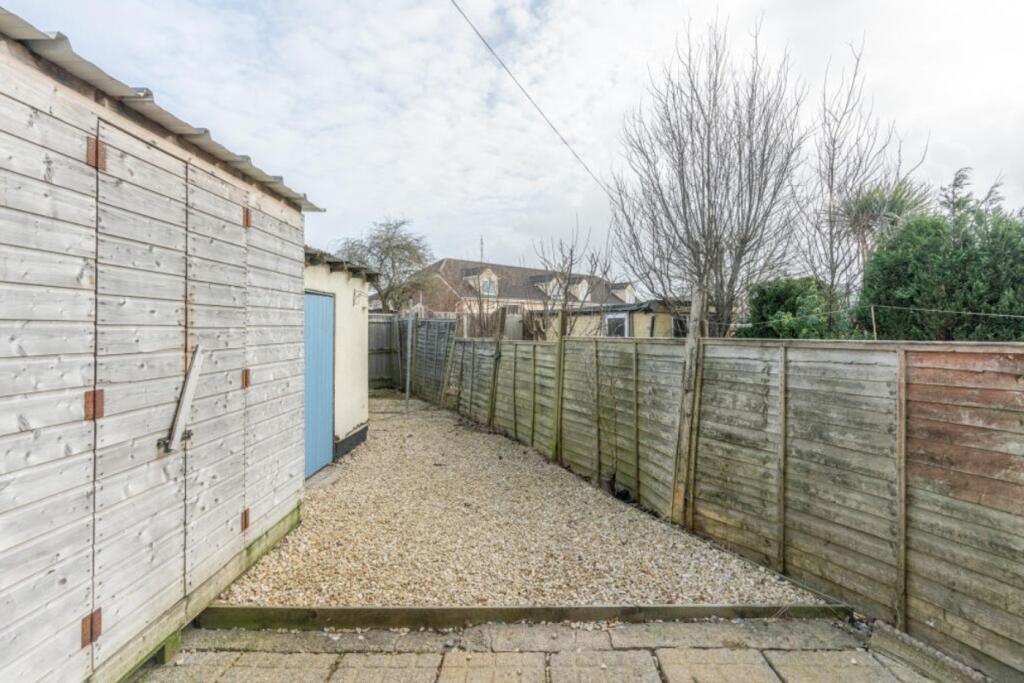 A spacious and well-maintained garden area, per...
