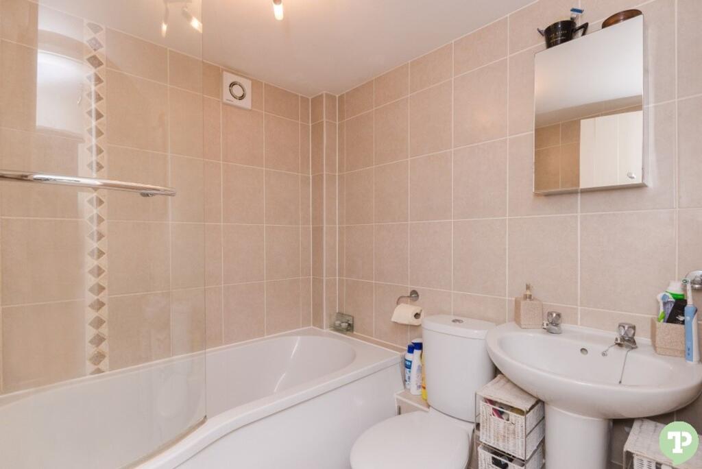 Bathroom with shower over bath