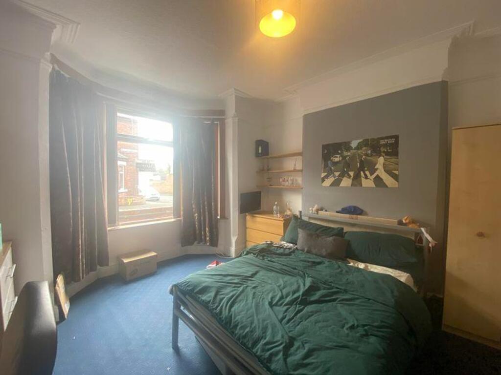 A spacious and bright double bedroom with large...