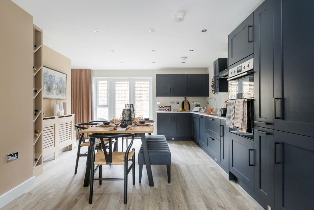 Double doors lead out from the kitchen to the garden