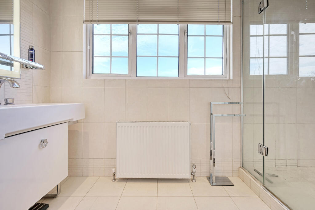 En suite shower and vanity unit to master bedroom.