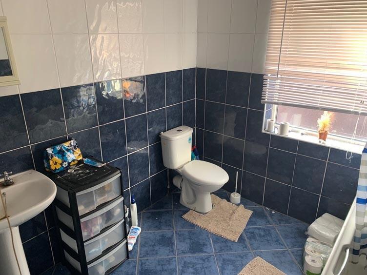 A clean and functional bathroom with a toilet a...