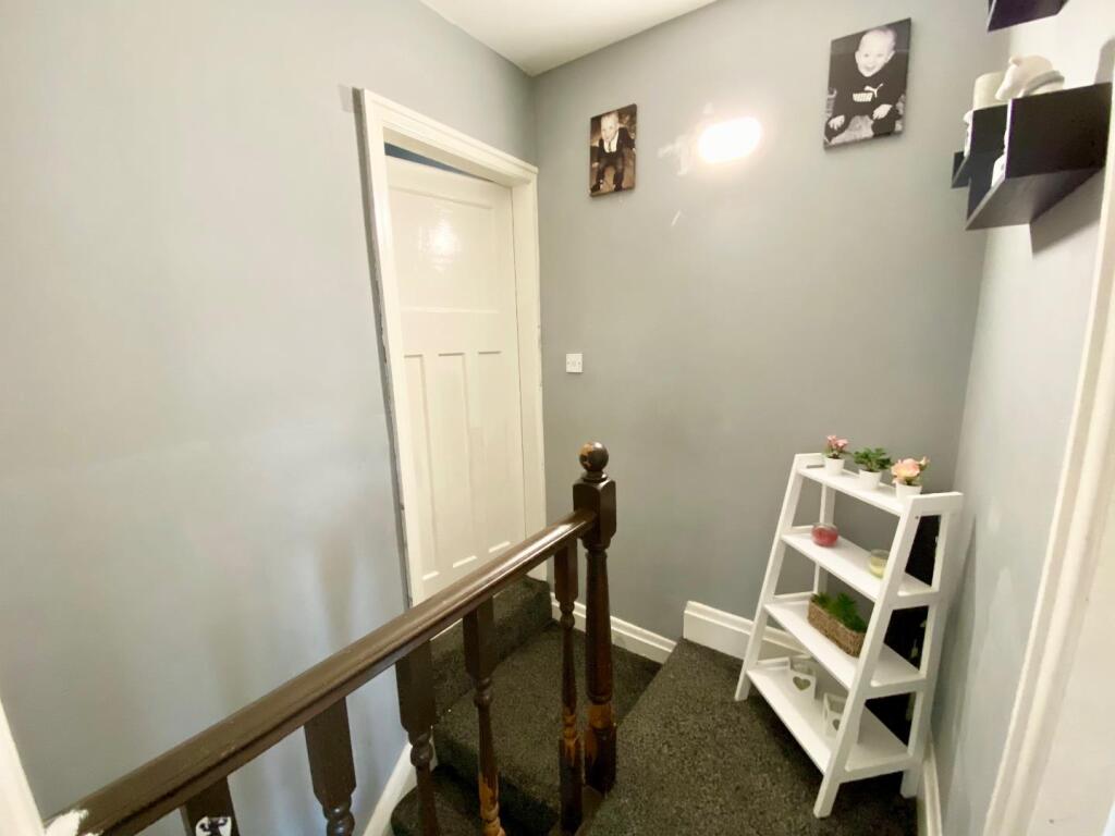 TO THE FIRST FLOOR LANDING
