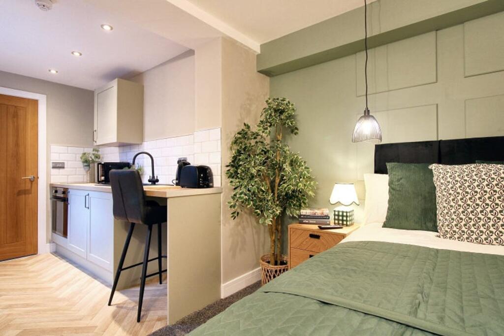 This inviting double bedroom combines style and...