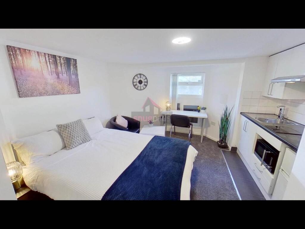Bright and inviting living room featuring a com...