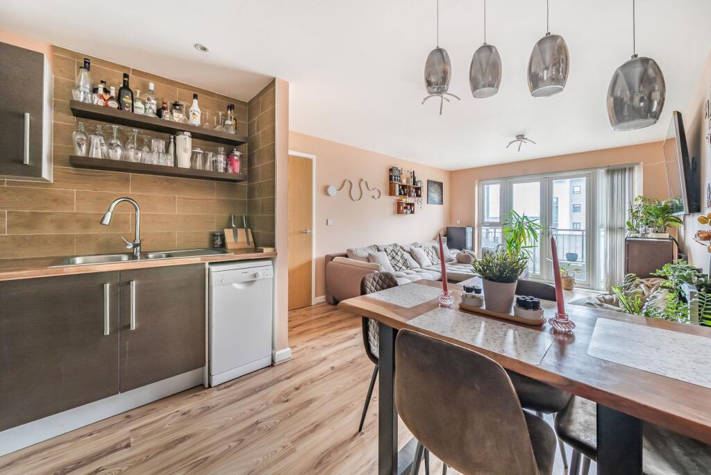 Open plan living space with balcony