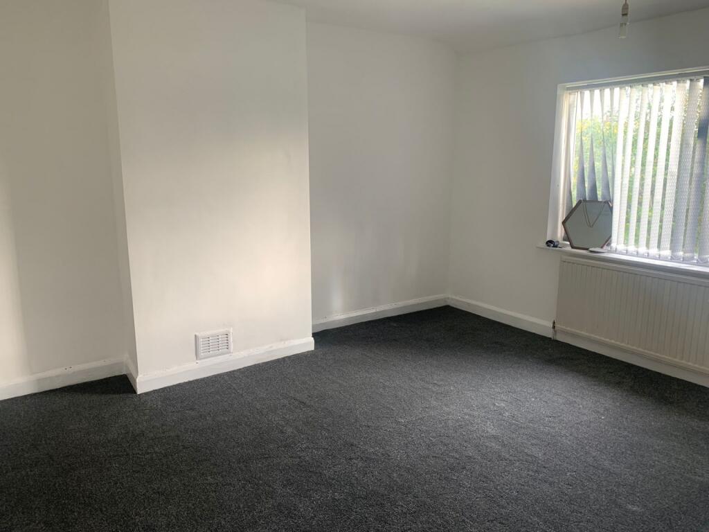 A bright and clean double bedroom featuring a l...