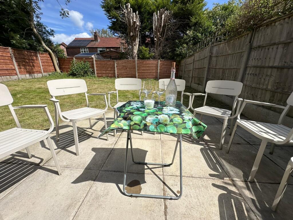 A beautifully maintained garden space featuring...