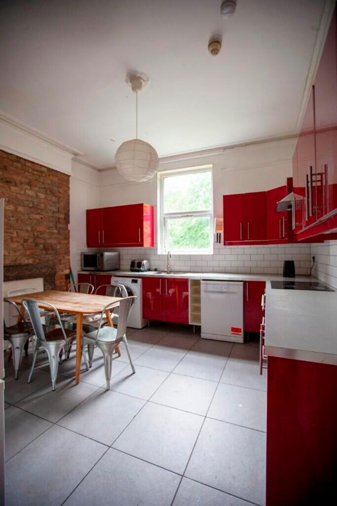 A bright and modern kitchen featuring stylish r...