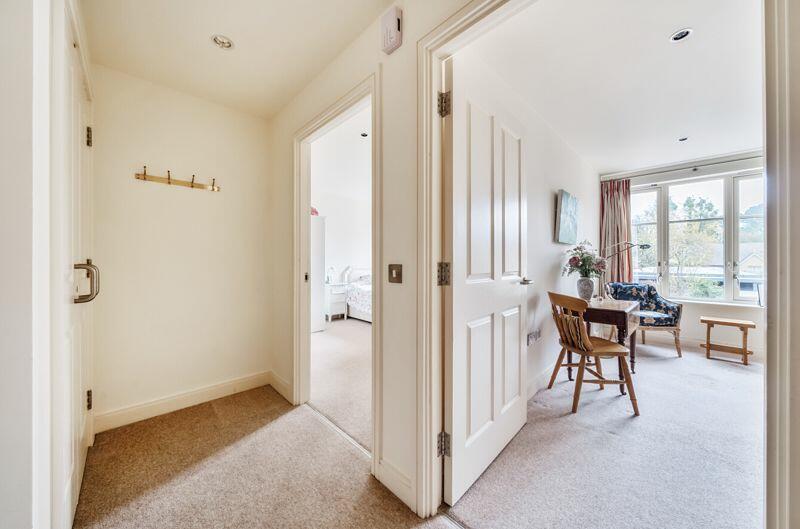 Hallway with storage cupboard