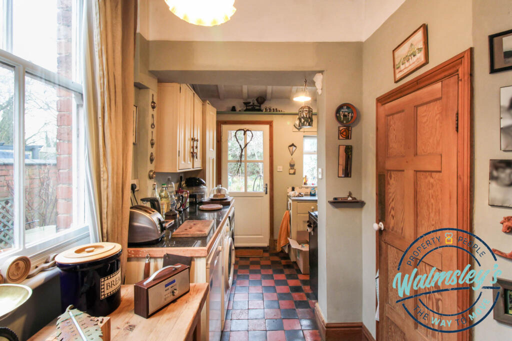 Dining room with pantry &amp; kitchen beyond