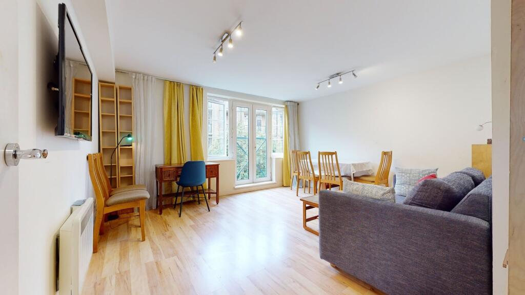 Bright and airy living room bathed in natural l...