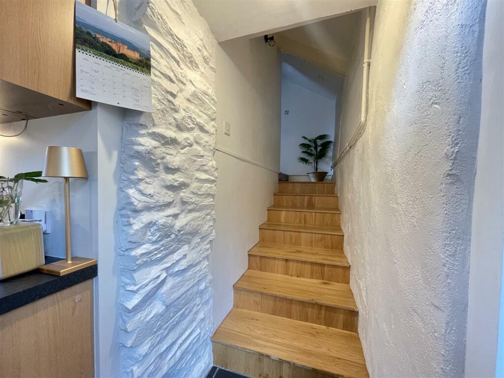 With Stairs from the Kitchen