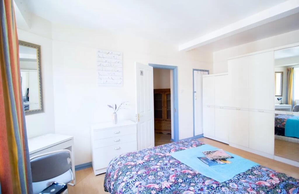 Bright and inviting double bedroom featuring a ...