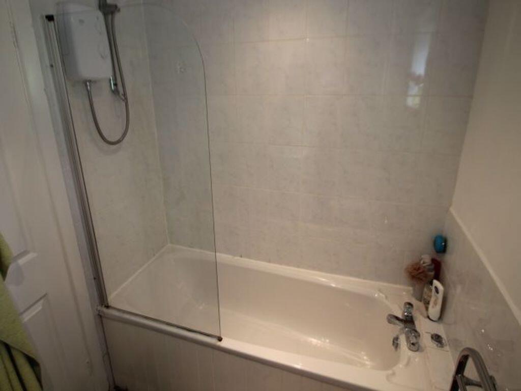 A clean and modern bathroom featuring a white b...