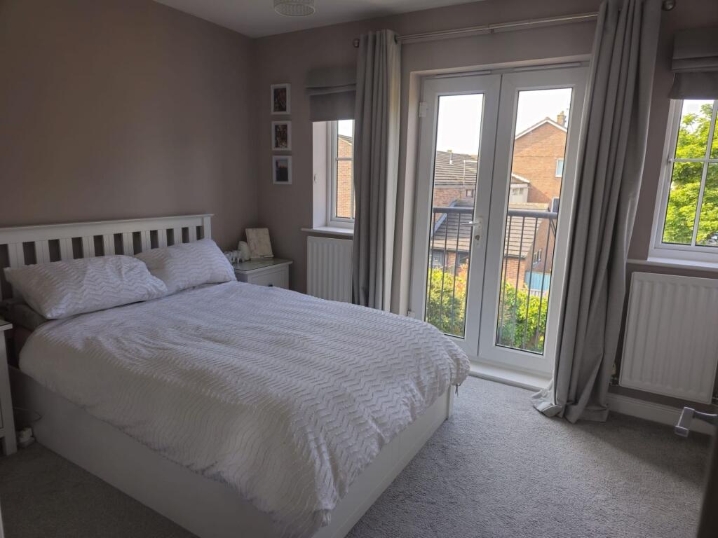 Bright and inviting master bedroom featuring a ...