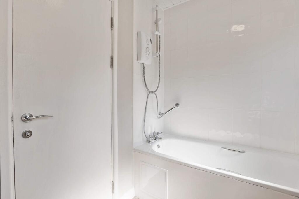 A bright and modern bathroom featuring a clean ...