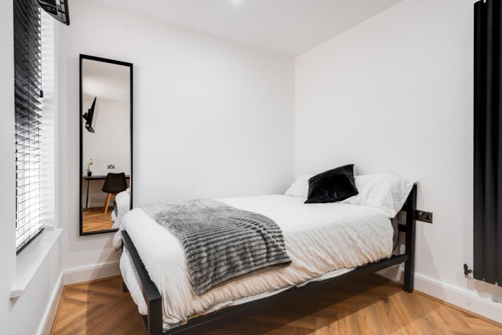A stylish and clean double bedroom with ample n...