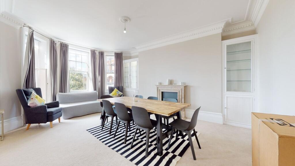 A bright and airy living room featuring a large...