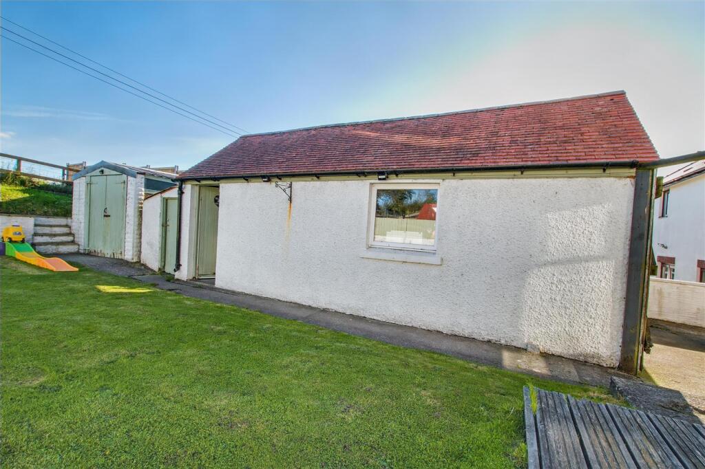 Detached garage and store sheds
