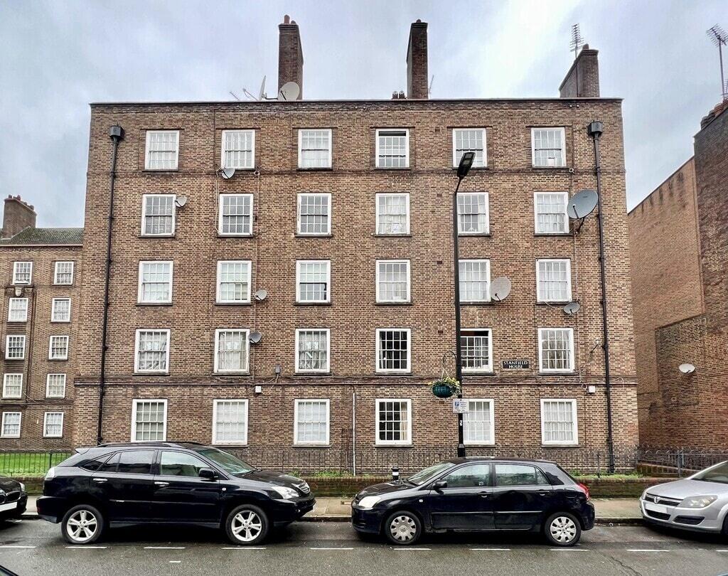 A classic brick terraced residential building w...
